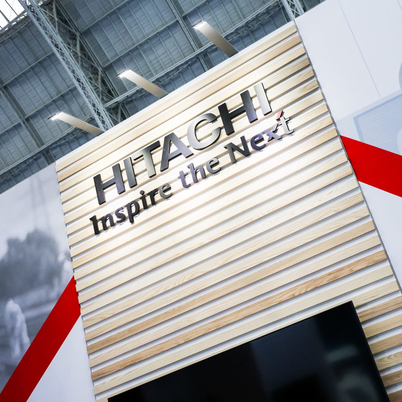 Hitachi exhibition stand at Railex. Detail shot of wall logo